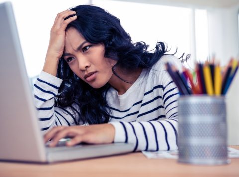 Woman confused by the cost of copycat websites